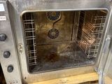 a small oven that is sitting on a pallet
