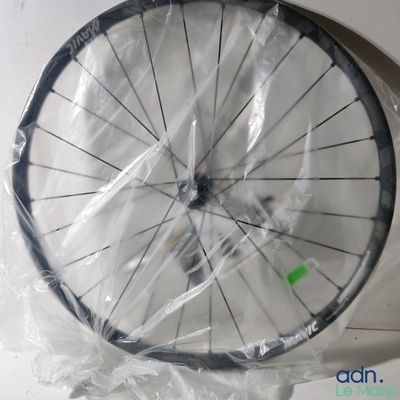 a bicycle wheel that is wrapped up in plastic