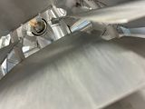 a close up view of a metal object that is being worked