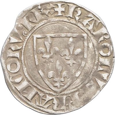 a close up of a coin with a coat of arms on it