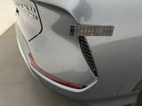 a close up of a car ' s bumper with a sticker on it