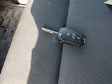 a car key sitting on the back seat of a car