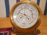 a clock that is on a table with a book