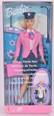 poupée Barbie dans une boîte, avec une veste rose et un chapeau