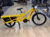a yellow bicycle that is on display in a store