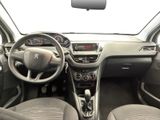 the interior of a small car with a steering wheel and dashboard