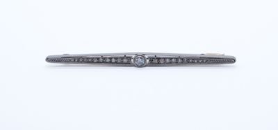 a close up of a diamond ring on a white surface