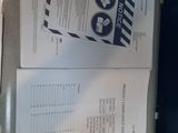 two pages of paper that are on top of a box