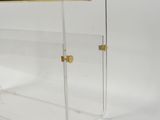 a clear acrylic display case with a brass handle