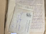a box with a lot of old papers in it