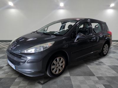 a picture of a gray car parked in a garage