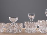 six wine glasses sitting on a table next to each other