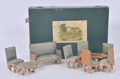 a doll house living room set with chairs and a table