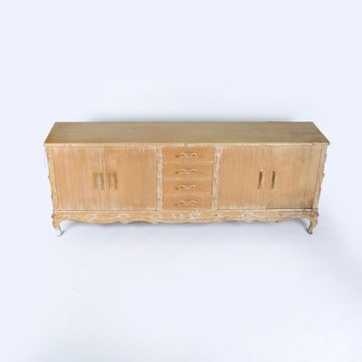 a wooden cabinet with drawers and drawers on top of it