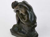 an image of a statue of a man with his head in his hands