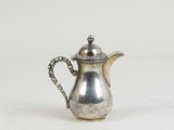 a silver coffee pot on a white background