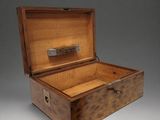 an old wooden box with a lock on the inside of it