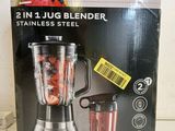 packaging of a blender sitting on a counter top with a blender in front of it