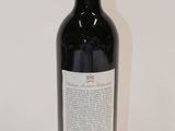 a bottle of wine that is sitting on a table