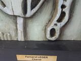 sculpture of a horse ' s head on a wooden plaque with a plaque underneath it