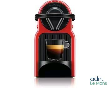 an image of a red coffee machine with a cup of coffee