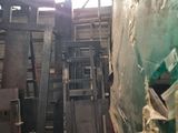 many pieces of wood stacked on top of each other in a warehouse