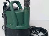 a green and black submerst and a black hose on a white surface