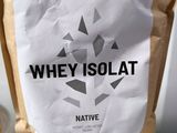 a bag of whey solat sitting on a toilet