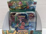 a box of pokemon trading cards with a box of them
