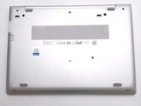 a close up of a silver laptop with a blue sticker on the back of it