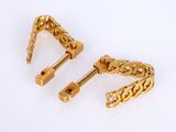 a pair of gold tone earrings with filigreed design