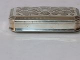 a silver box that is sitting on a table