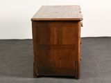a small wooden cabinet with a tile top on the floor