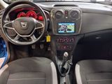 the interior of a small car with a steering wheel and dashboard