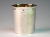 a silver cup that is sitting on a table