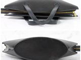 two images of a black purse with a zipper on the inside
