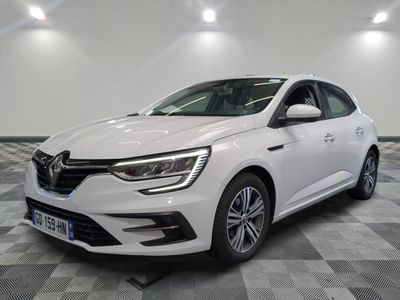 a white car is parked in a room with a checkered floor