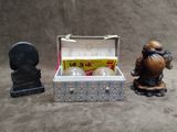 figurines of a man and a box of eggs and a statue of a man