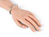 silver tone bracelet with black and white stones on a mannequin hand