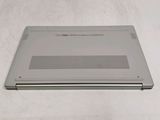 a silver laptop that is sitting on a table