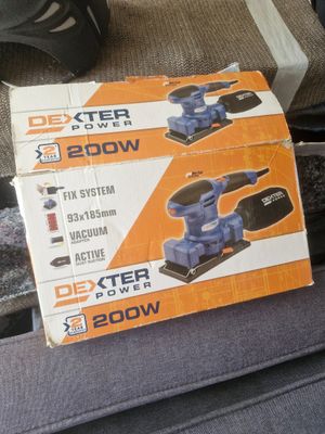 two boxes of power tools are sitting on the seat of a car