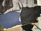 a pile of clothes sitting on top of a wooden table