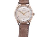 wrist watch with brown leather strap and white dial on white background