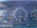 a close up of a car dashboard with various gauges