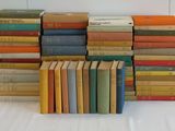 a lot of books stacked on top of each other
