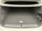 a trunk of a white car with its trunk open