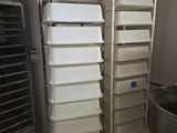 many bins that are stacked up in the kitchen