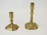 pair of antique brass candlesticks on a white background