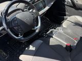 the interior of a car with a steering wheel, dashboard, and dash board