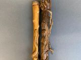 an image of a wooden walking stick with a woman on it